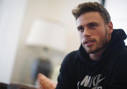 Gus Kenworthy, a freestyle skier who won a silver medal in Sochi, speaks in his home in Denver on Oct. 21, 2015. "We're in China, so we play by China's rules. And China makes their rules as they go, and they certainly have the power to kind of do whatever they want: Hold an athlete, stop an athlete from leaving, stop an athlete from competing," Kenworthy said on Sunday, Feb. 20, at the 2022 Beijing Olympics. 