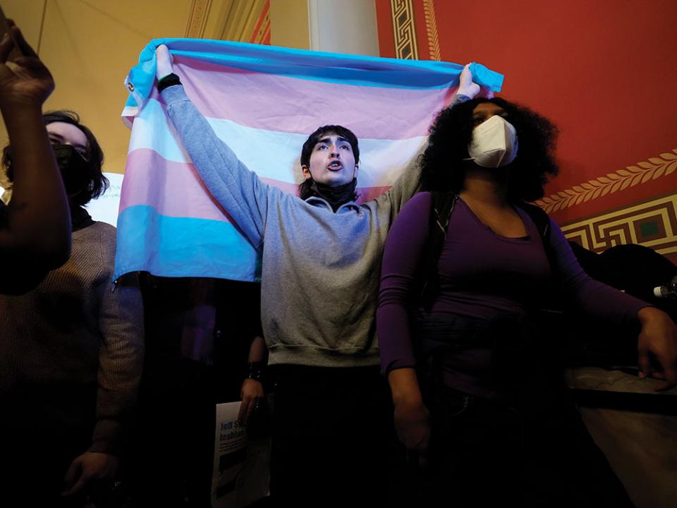 LGBTQ+ rights supporters rally in the hallway outside an Iowa House Judiciary subcommittee hearing, Wednesday, Jan. 31, 2024, at the Statehouse in Des Moines, Iowa. The rights of LGBTQ+ people continue to be in flux across the U.S. with a new flurry of developments. AP Photo by Photo/Charlie Neibergal.